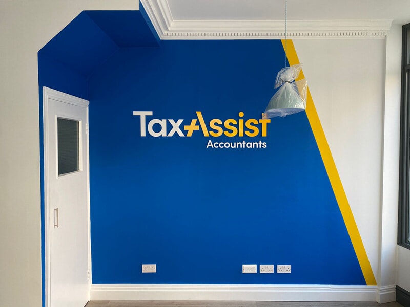 An image of the TaxAssist wall graphic they used for several locations.